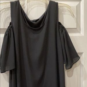 Black dress, cold shoulder style.